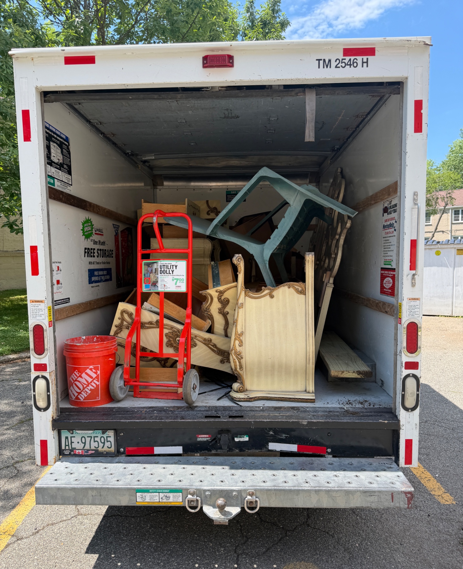 Last Load Junk Removal truck loaded with furniture and items